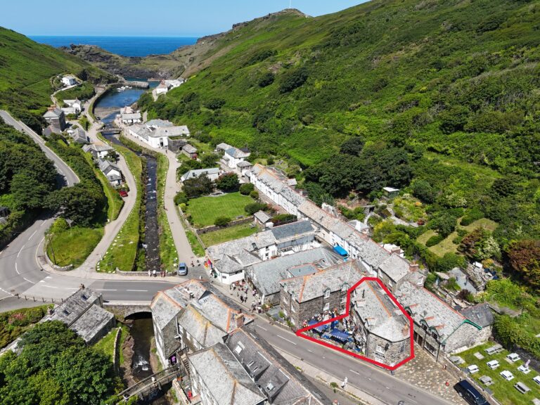Aerial view of Boscastle village and harbour in North Cornwall, showing a central property outlined in red within the coastal valley.