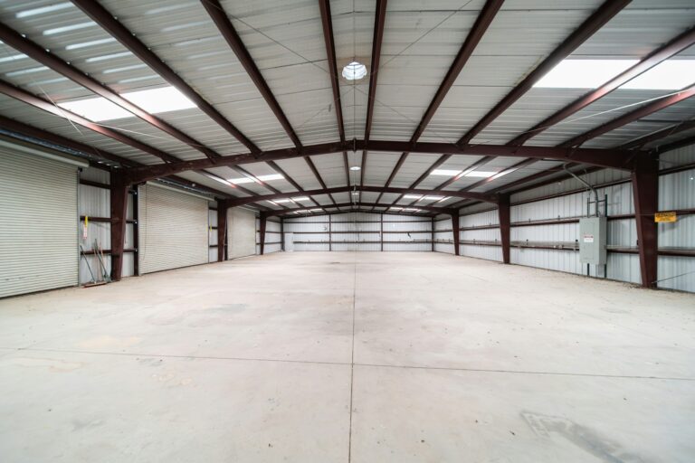 Vacant commercial warehouse with cardboard boxes, illustrating empty property rates mitigation.