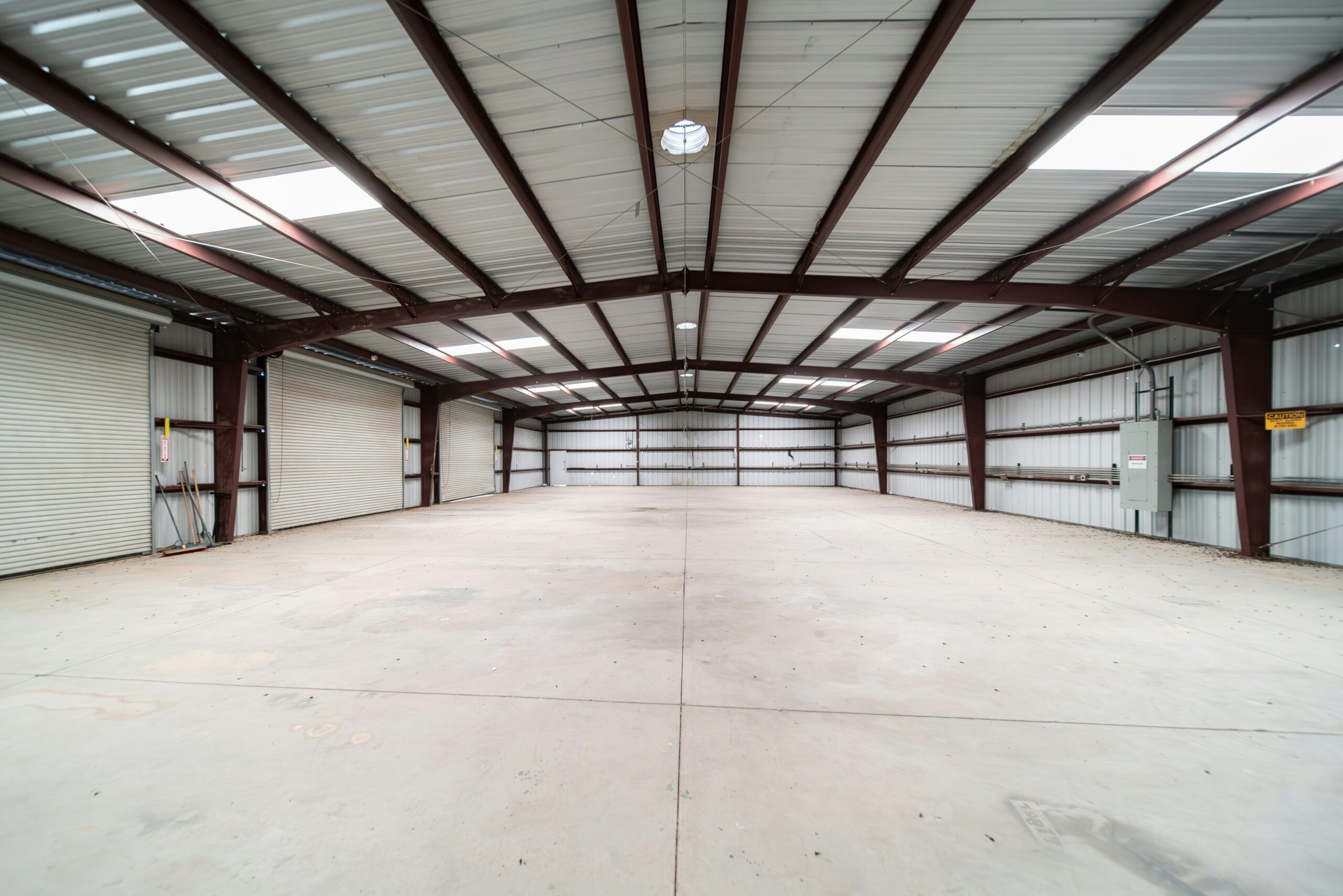 Vacant commercial warehouse with cardboard boxes, illustrating empty property rates mitigation.